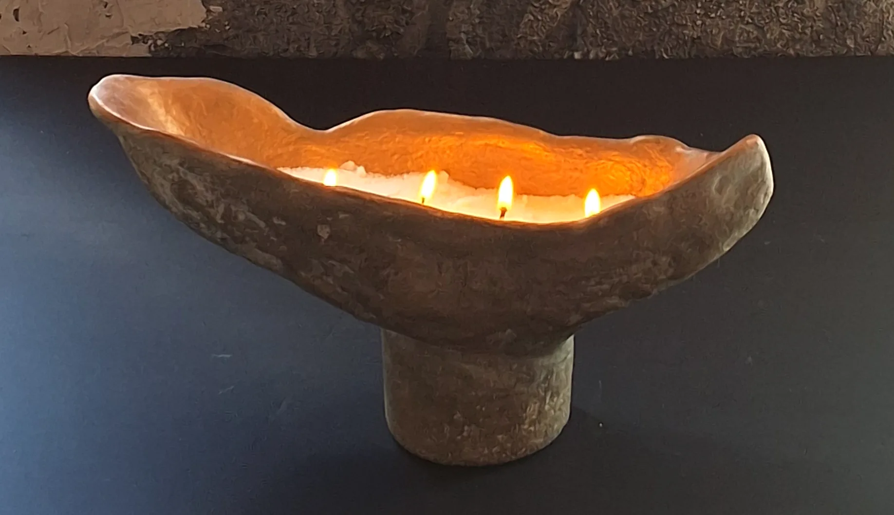Raised concrete piece activated with fire