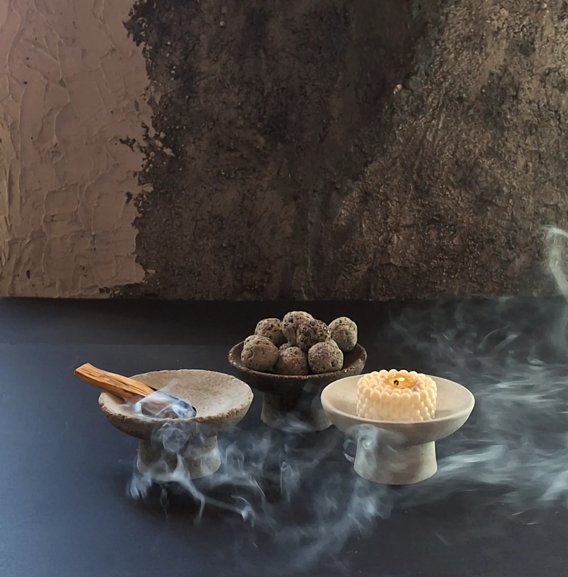 Group of concrete pieces activated with scent and smoke